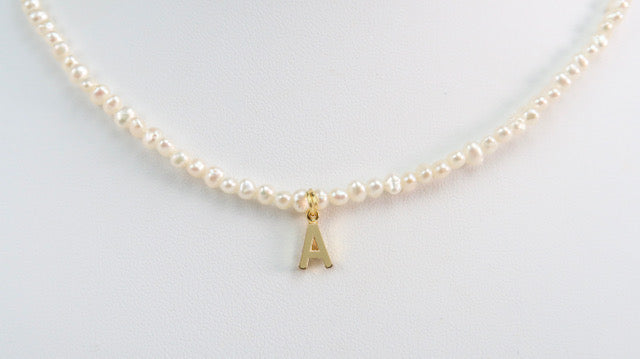 A Necklace with Gold Plated letter